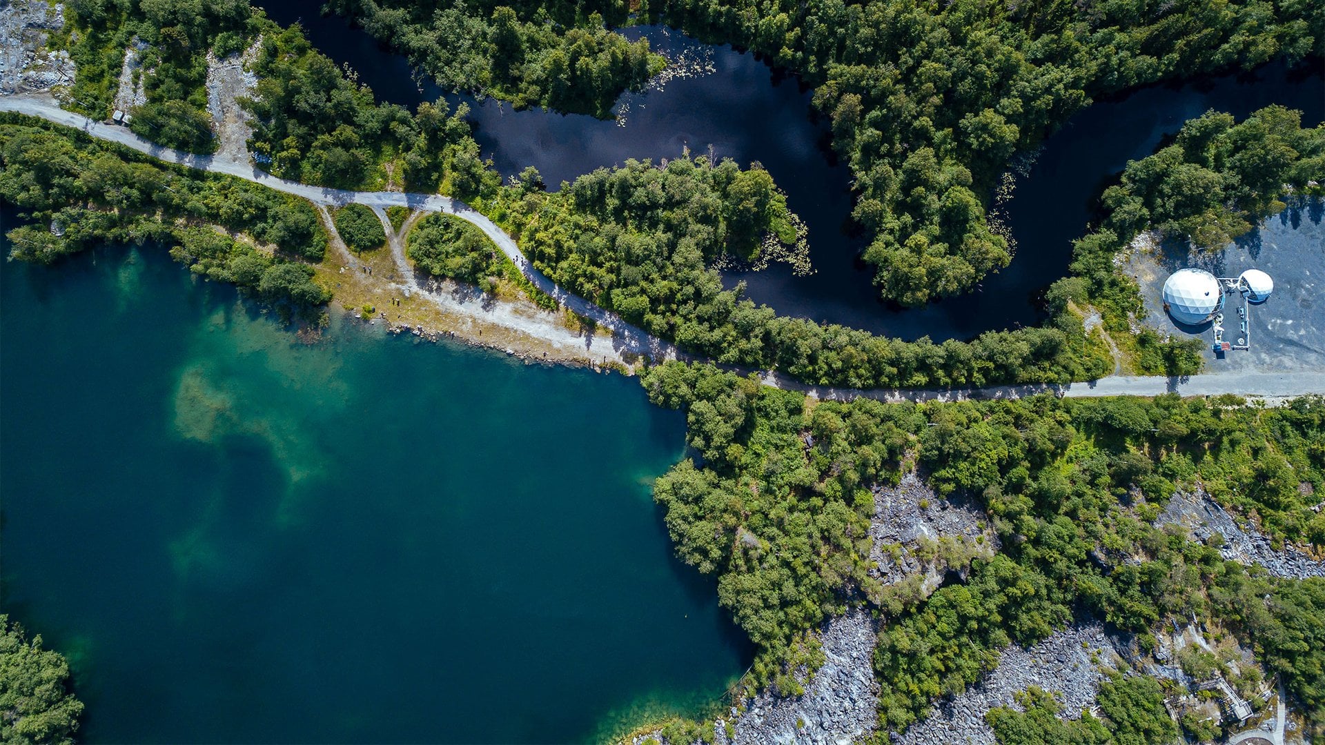img-canopy-branded-mining-aerial-view-of-green-forest-surrounding-marble-quarry-lake-river