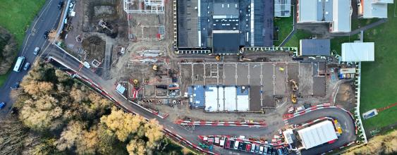 Aerial view of an active construction site with roadworks, buildings and infrastructure development in progress - Thumbnail size