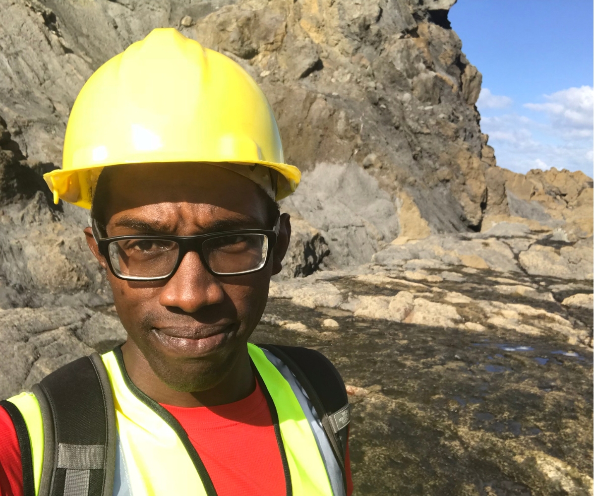 Chris on site collecting geological data from sequences of rocks 
