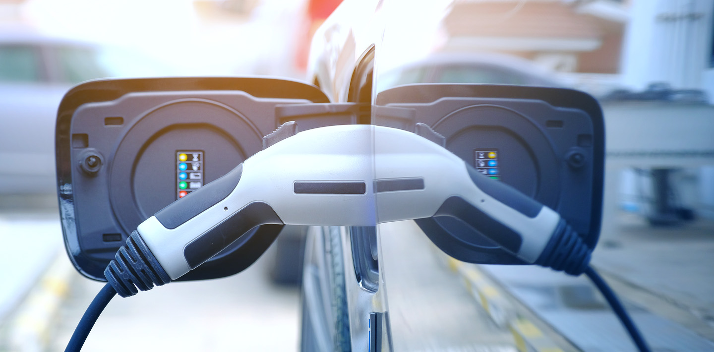 img-bipartisan-infrastructure-law-highways-charging-vehicle