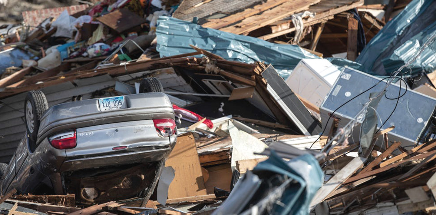 img-tornado-response-debris-car-overturned