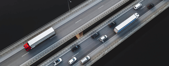 thnAerial view of traffic vehicles driving on the highway bridge over the Neman river in Kaunas Lith