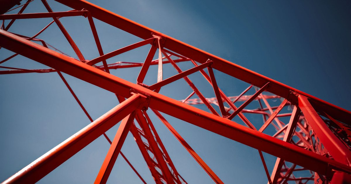 some-sodertaljepassagen-red-metal-structure-against-blue-sky-background