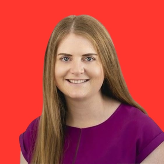 Headshot of a person with long hair wearing a purple top against a red background.