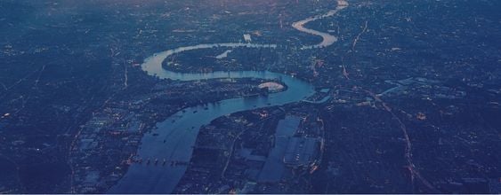 An aerial view along the River Thames looking towards London in the United Kingdom