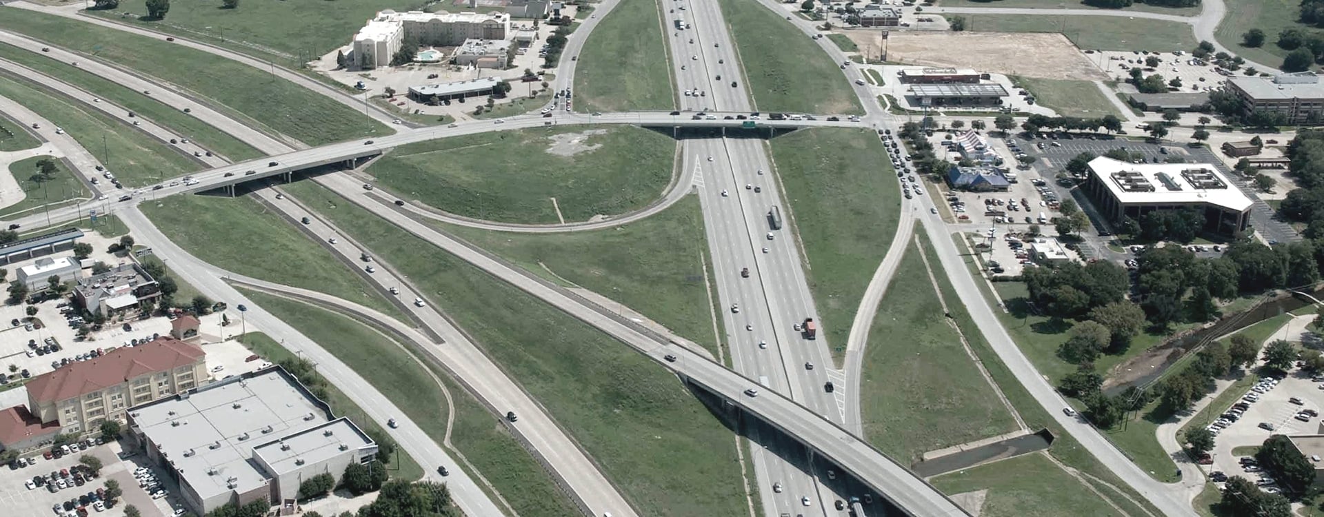 Aerial view of multiple Texas highways and Interstates merging into a complex intersection